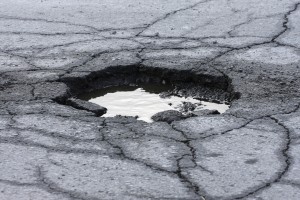 how pot holes can damage your car