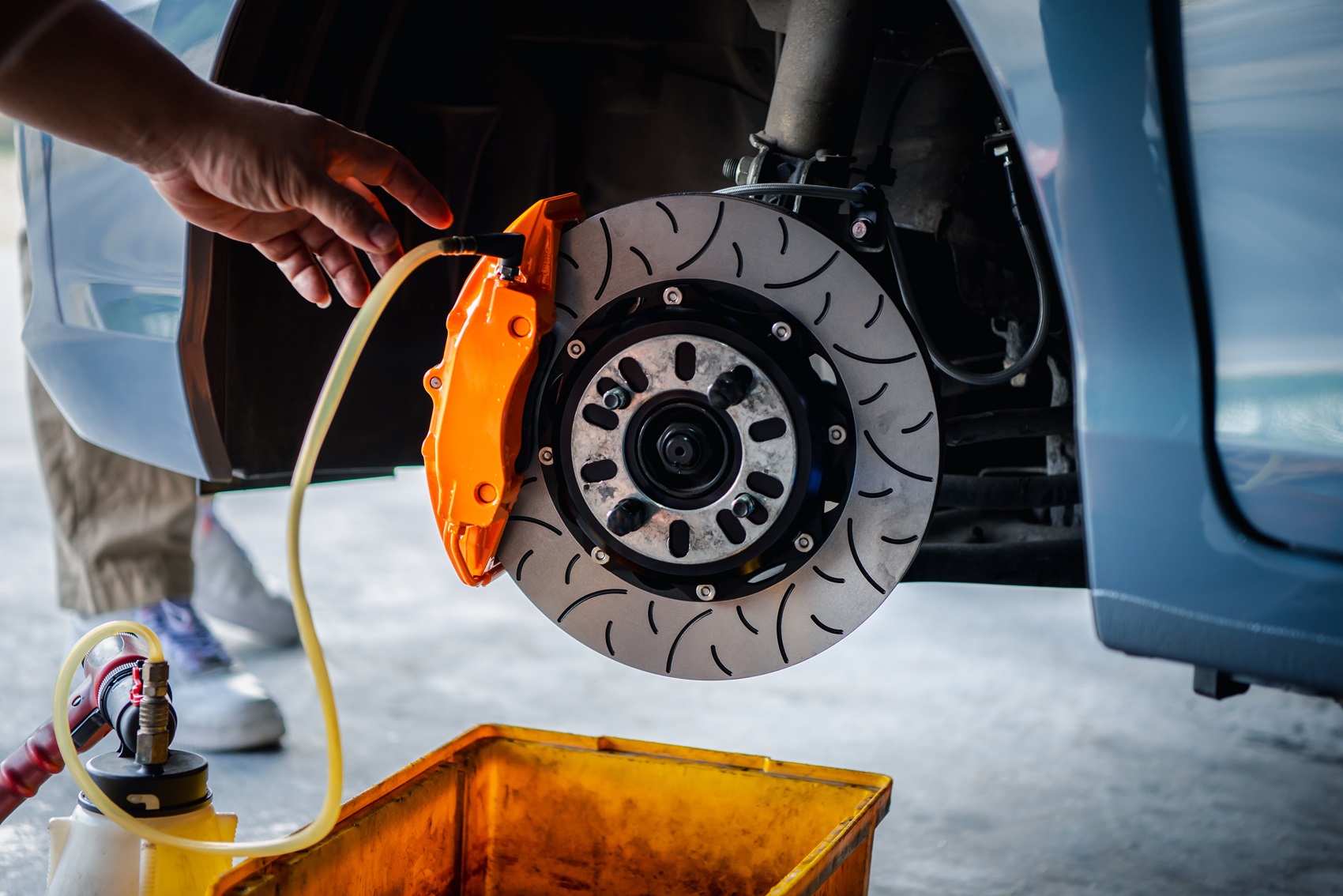 Mechanic conducting brake service